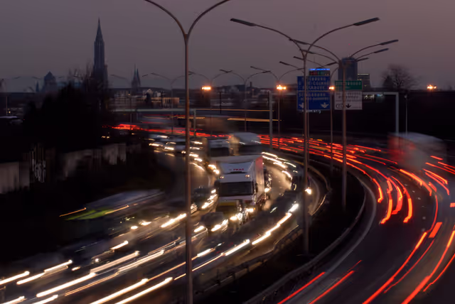 Снимка 7: Vehicles in motion blur at dusk on the ring road of Strasbourg, France, in the 1990s.