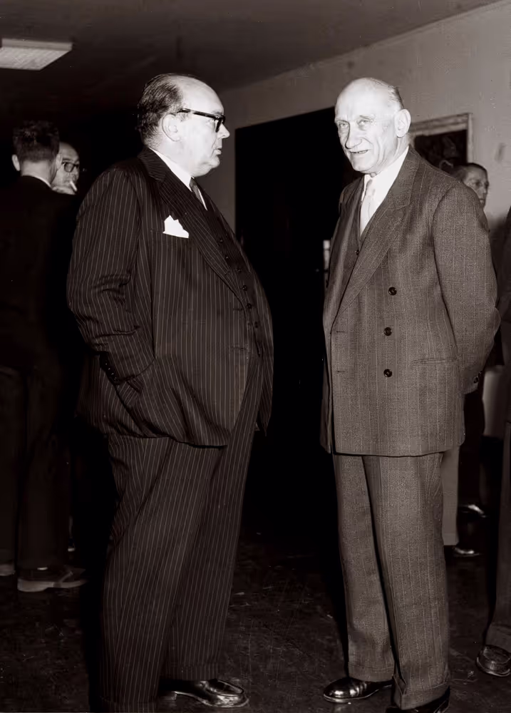 Paul-Henri Spaak chats with Robert Schuman