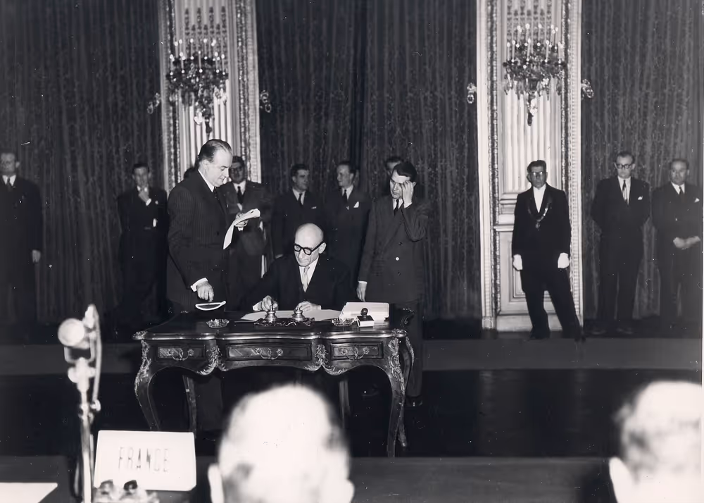 Robert Schuman signs the Paris Treaty in 1951 creating the European Coal and Steel Community (ECSC)