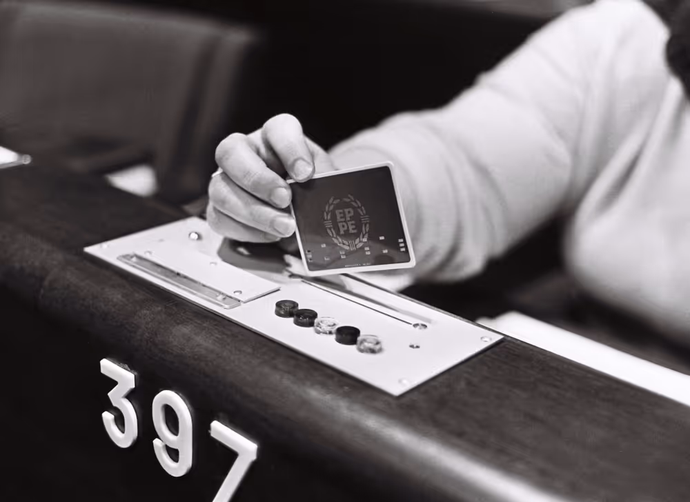 Illustration picture showing a hand holding an electronic vote in the hemicycle of the European Parliament in Strasbourg in October 1979.