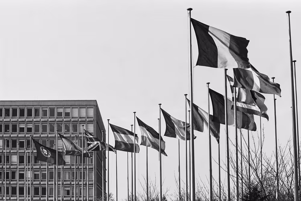 Flags waving outside the Robert Schuman building in Luxembourg