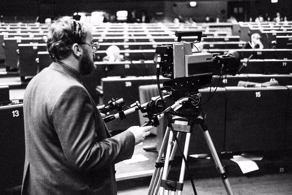 A cameraman films during a plenary session at the European Parliament