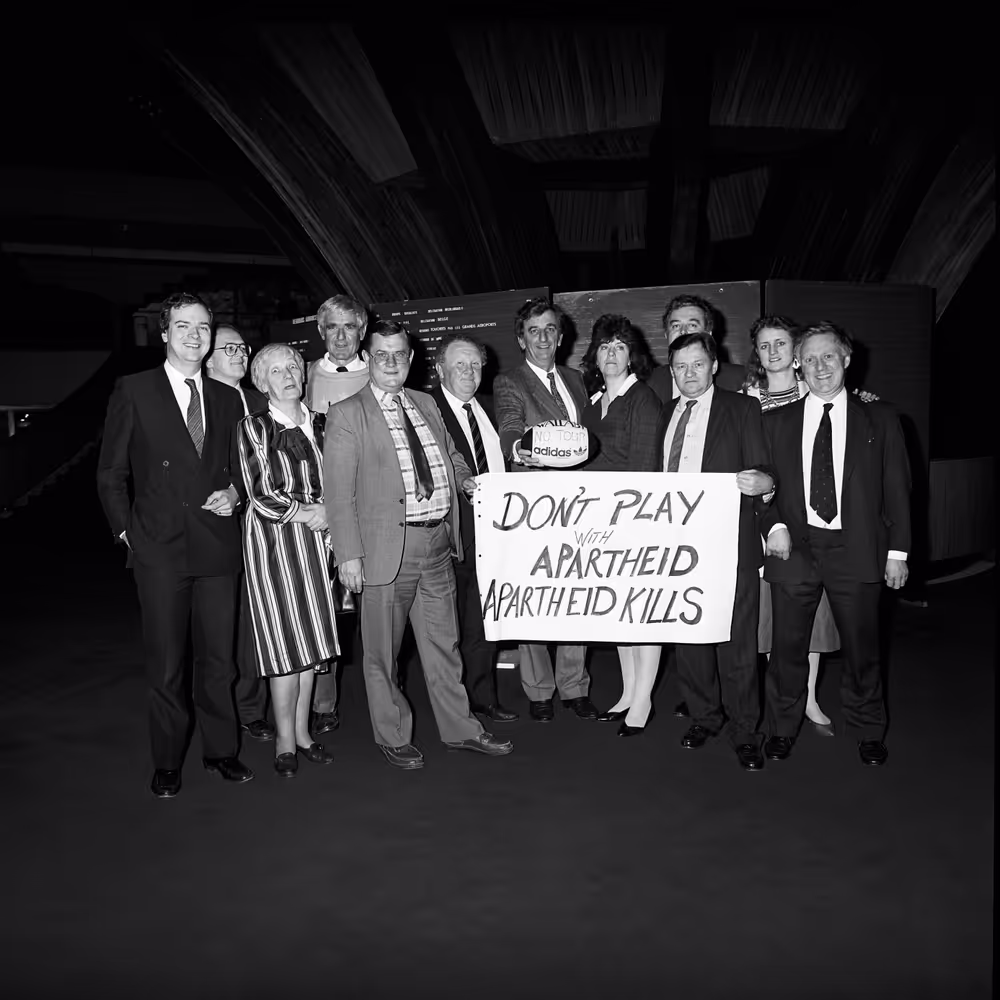 British and Irish MEPs with a banner that reads ' Don't play (rugby) with apartheid - Apartheid kills '