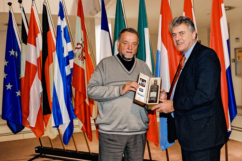 Mr BLAK and Mr NICHOLSON with a gift for the president