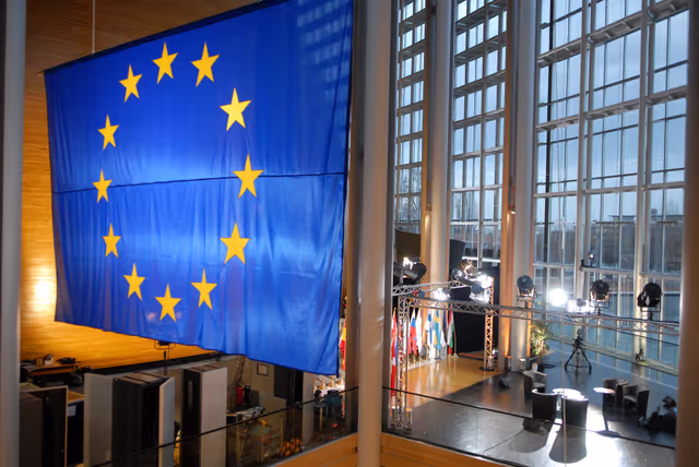 Снимка 4: A European flag hangs inside the European Parliament building Louise Weiss in Strasbourg - LOW