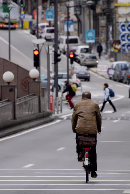 Снимка 21: Man on a bicycle in the streets of Brussels