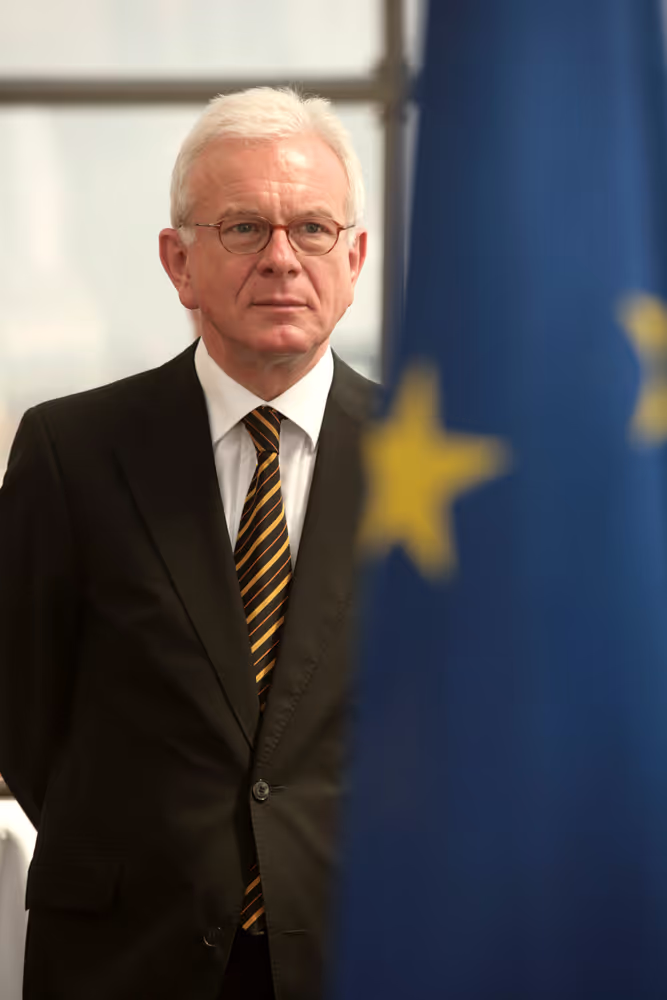 Hans Gert POETTERING - EP President behind a flag in Brussels