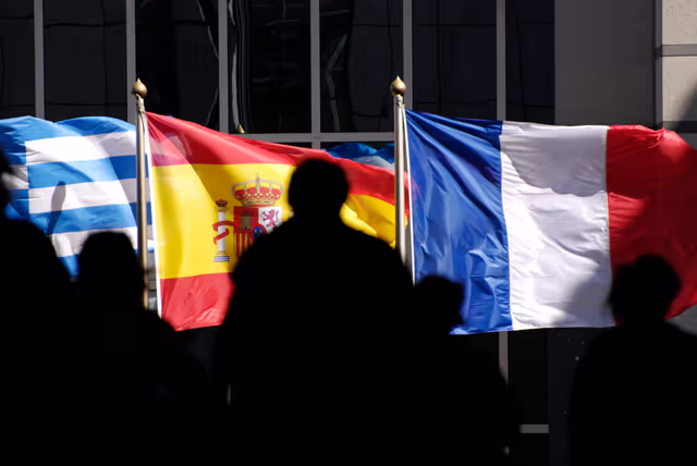 Photo 22: People walking in front of the flags of the EU member states at the EP in Brussels.