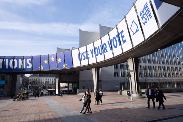Photo 14: 2024 European elections campaign banner on the Agora Simone Veil of the European Parliament in Brussels