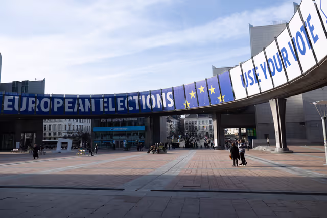 Photo 13: 2024 European elections campaign banner on the Agora Simone Veil of the European Parliament in Brussels