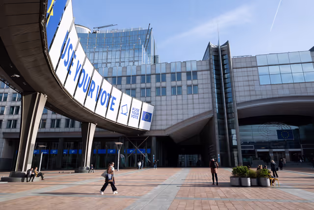 Photo 11: 2024 European elections campaign banner on the Agora Simone Veil of the European Parliament in Brussels