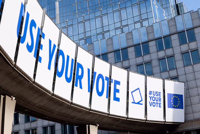Photo 10: 2024 European elections campaign banner on the Agora Simone Veil of the European Parliament in Brussels