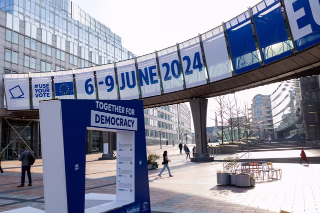 Photo 8: 2024 European elections campaign banner on the Agora Simone Veil of the European Parliament in Brussels