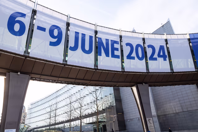 Photo 1: 2024 European elections campaign banner on the Agora Simone Veil of the European Parliament in Brussels