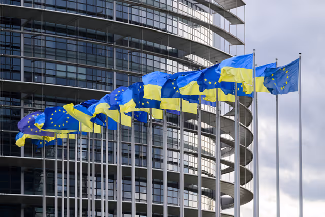 4 years anniversary of Russian aggression against Ukraine; Ukrainian and EU flags in front of the European Parliament in Brussels and Strasbourg