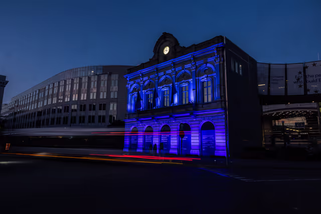 International Missing Children's Day 2026 - Station Europe building illuminated in blue