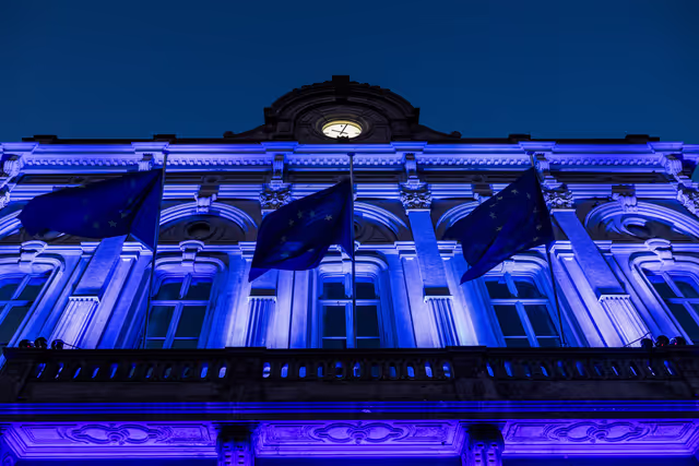International Missing Children's Day 2026 - Station Europe building illuminated in blue