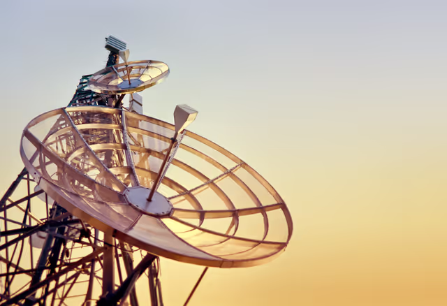 Suriet 4: Dishes on a telecommunications tower at the sunset