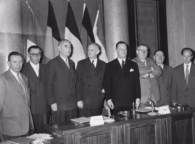 Henri WIGNY, Jean MEDECIN, André MUTTER, Emile SCHAUS,  Willi BIRKELBACH and Alain POHER pose for the photographer ahead of a meeting of the Transports Commission to examine the report diagram prepared by Mr. KAPTEYN (c) on the Common Market requirements for transport coordination, in Nice, France, April 26-27, 1957.